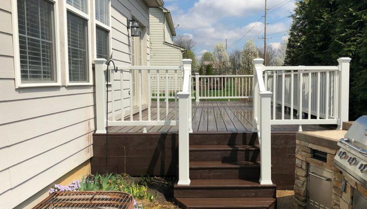 Trex Deck in Saddle. Trex Select Railing - Classic White.