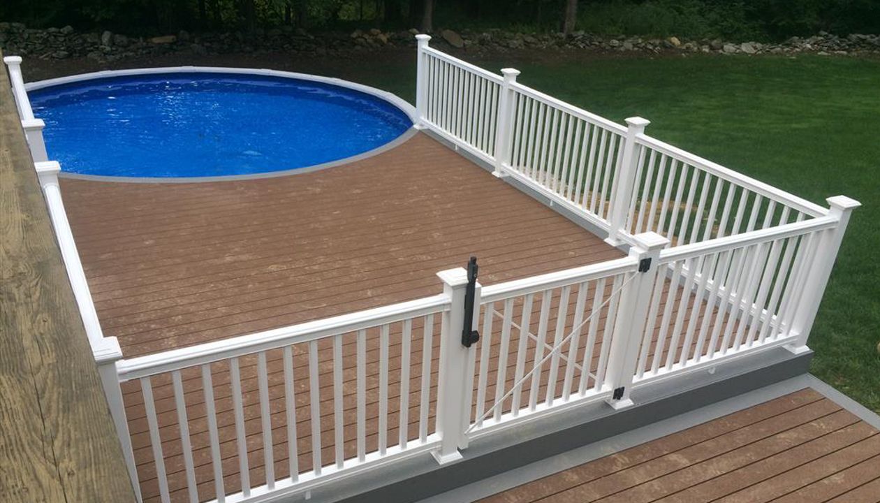 select saddle decking with pebble grey border, fascia and risers. vinyl rail