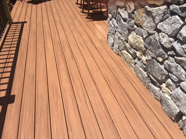 Trex Tiki Torch color looks great with stone siding