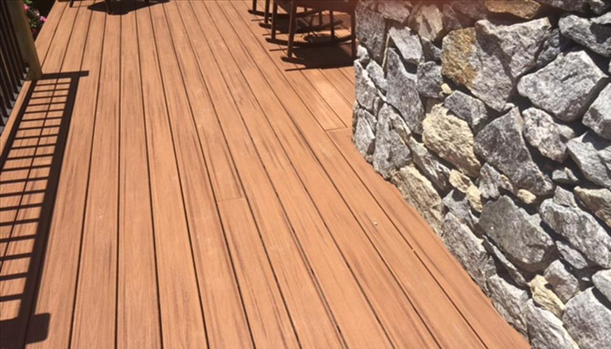 Trex Tiki Torch color looks great with stone siding