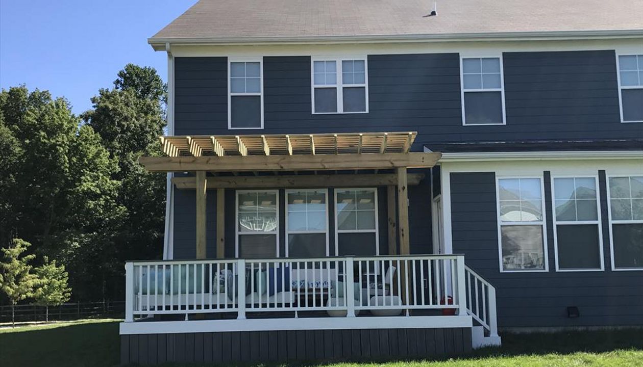 Trex deck with cocktail rail and pergola in Noblesville