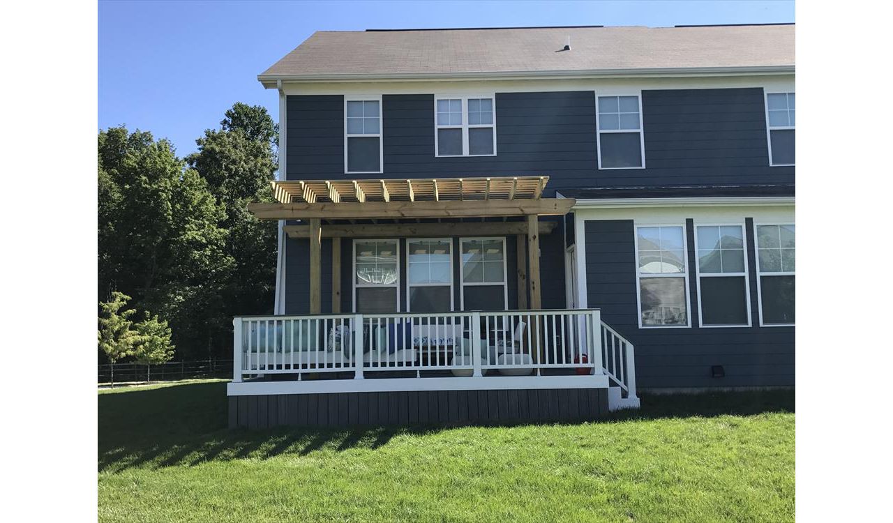Trex deck with cocktail rail and pergola in Noblesville