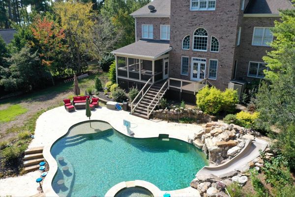 Beautiful Spice Rum Deck and Screened Porch to overlook this back yard pool resort