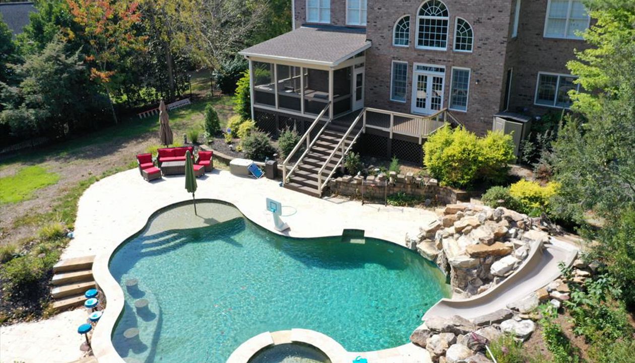 Beautiful Spice Rum Deck and Screened Porch to overlook this back yard pool resort