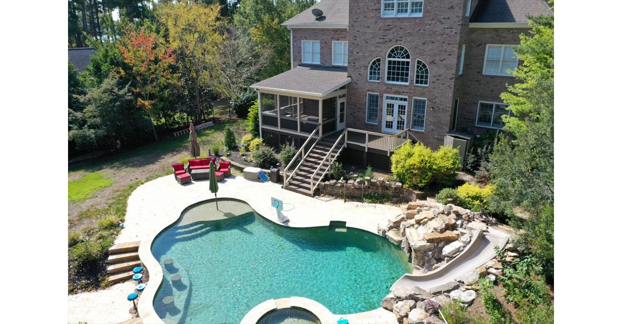Beautiful Spice Rum Deck and Screened Porch to overlook this back yard pool resort