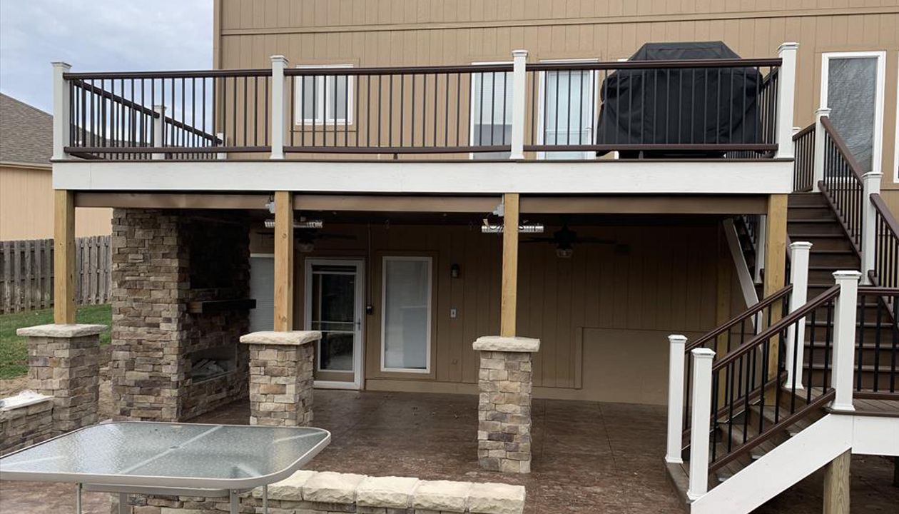 Trex Transcend Tropical (Spiced Rum) Deck with Trex Railing, Fascia and Lights - View of deck from straight on