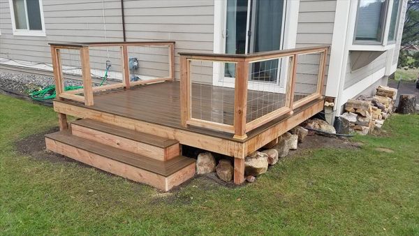 Brosseau Deck, Big Sky, MT. Project completion with wood frame/wire mesh railing and trex rail cap.