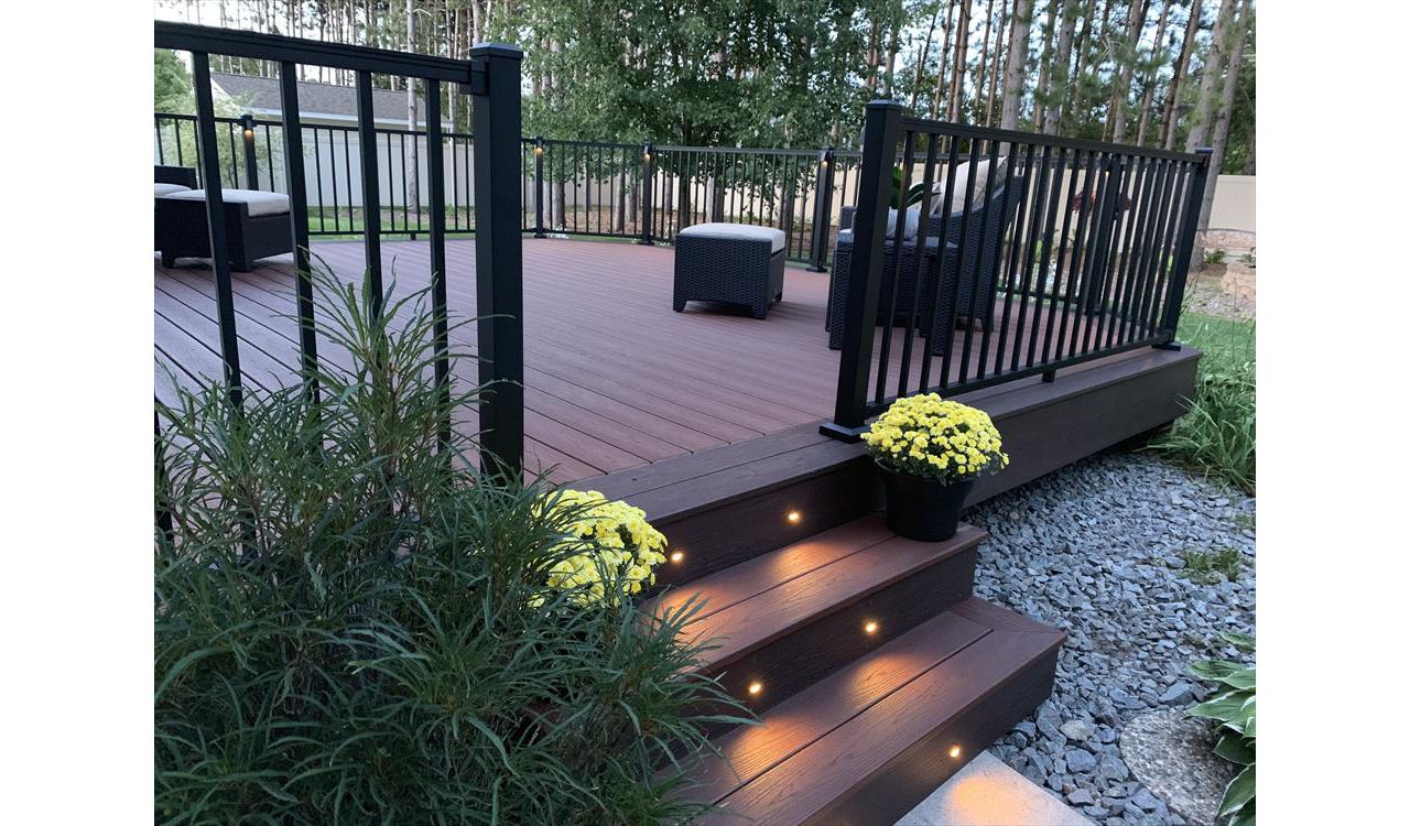 Spice up your outdoor living space with LED Trex lighting. Trex Transcend Fire Pit and Vintage Lantern with Trex Signature Black Aluminum Railing.