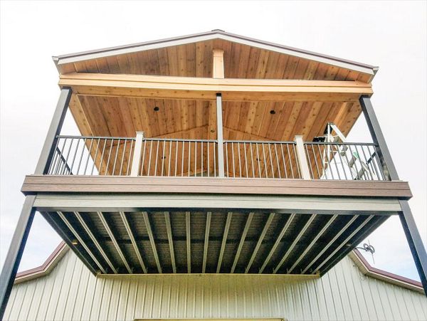 Trex Elevations steel framing with Transcend Tropical Spiced Rum decking and Trex Signature Aluminum black railing