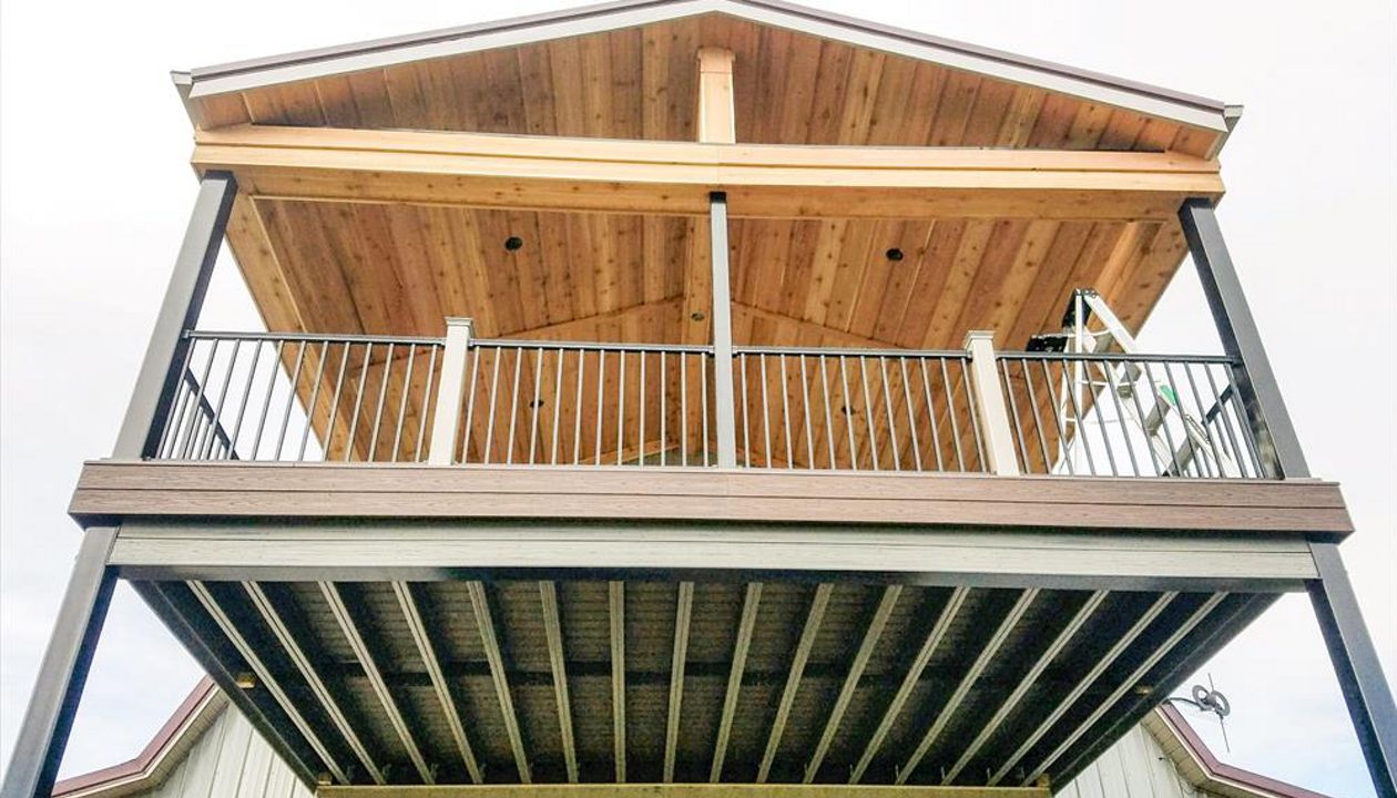 Trex Elevations steel framing with Transcend Tropical Spiced Rum decking and Trex Signature Aluminum black railing