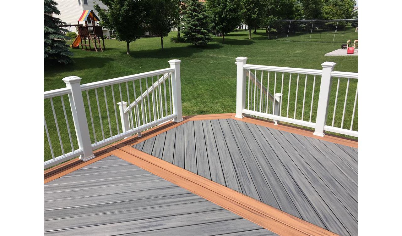 Trex Transcend Island Mist Deck with Tiki Torch Border and Trex Transcend Railing with Aluminum Balusters Rochester MN