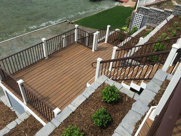 Trex Transcend Spiced Rum decking with Trex Signature Railing and Classic White Transcend post sleeves