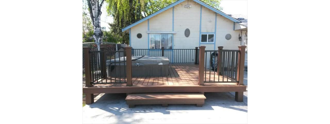 Transcends Decking: Tiki Torch &amp; Bronze Reveal Railing with Vintage Lantern Posts