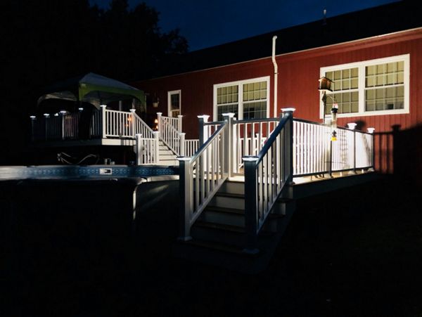 Multi level Havana Gold pool deck with lighted post caps