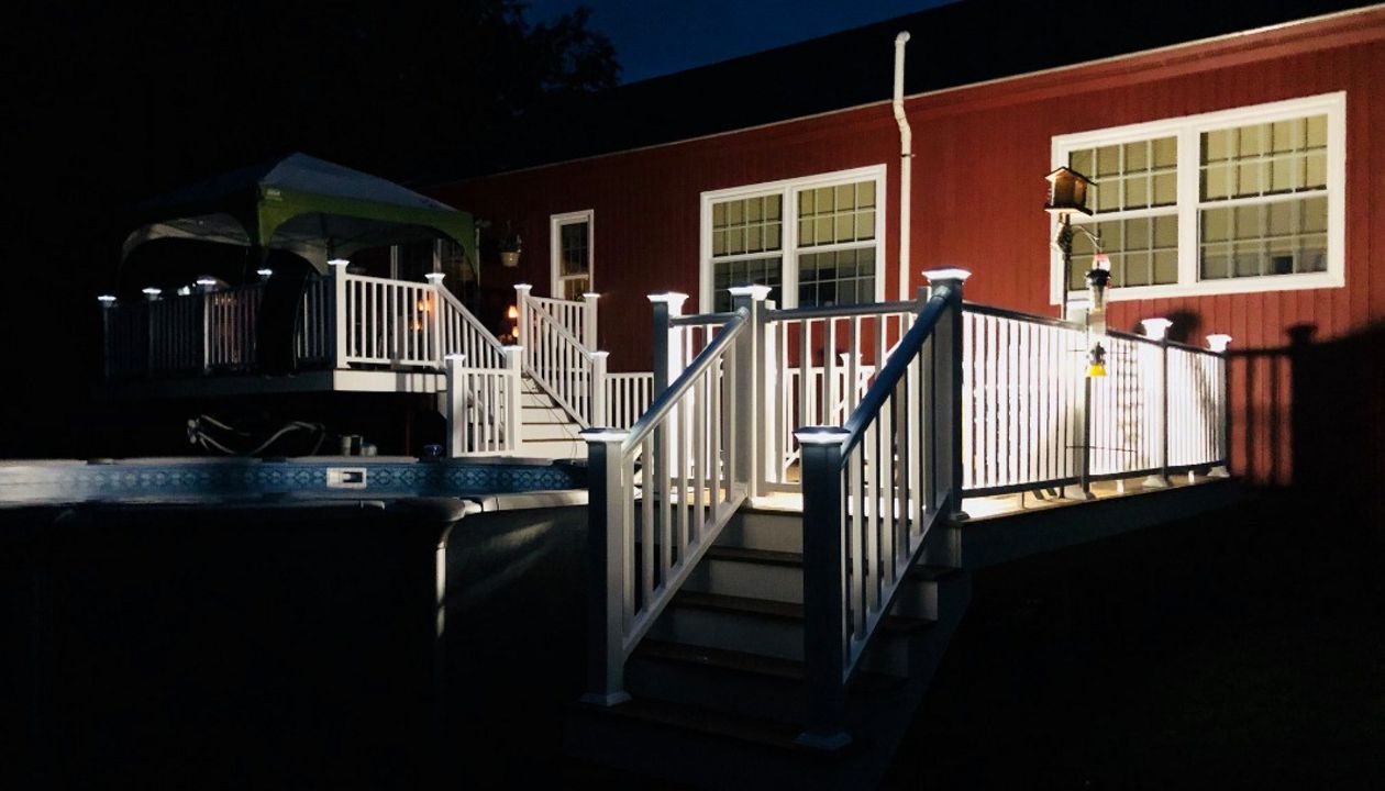 Multi level Havana Gold pool deck with lighted post caps