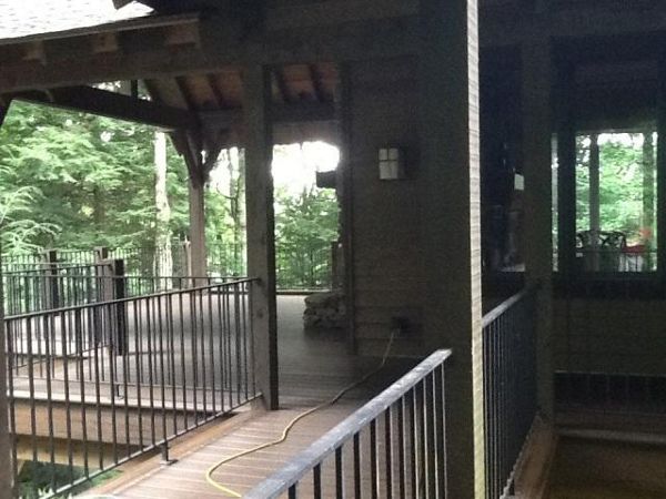 These black iron rails had to be re-painted unlike the Trex Spiced Rum decking