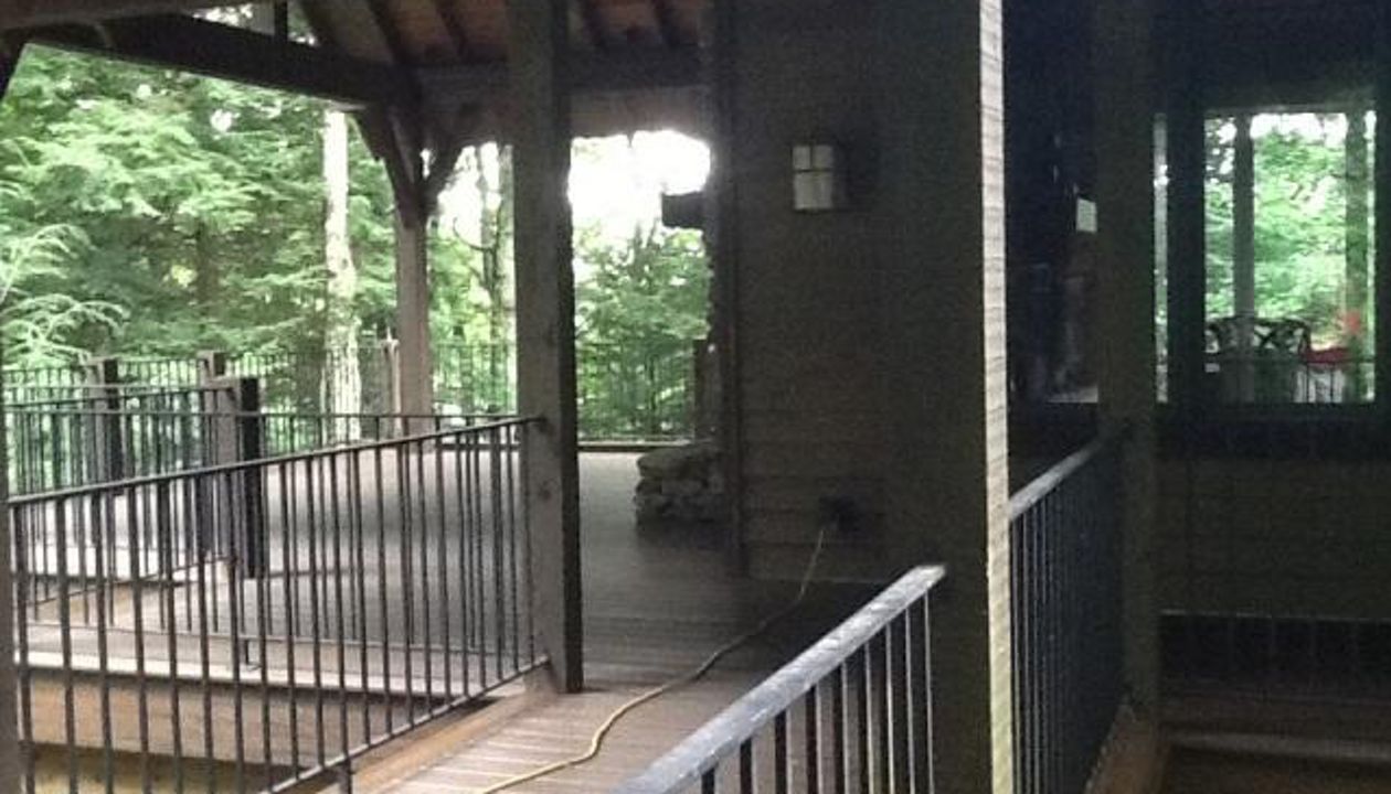 These black iron rails had to be re-painted unlike the Trex Spiced Rum decking