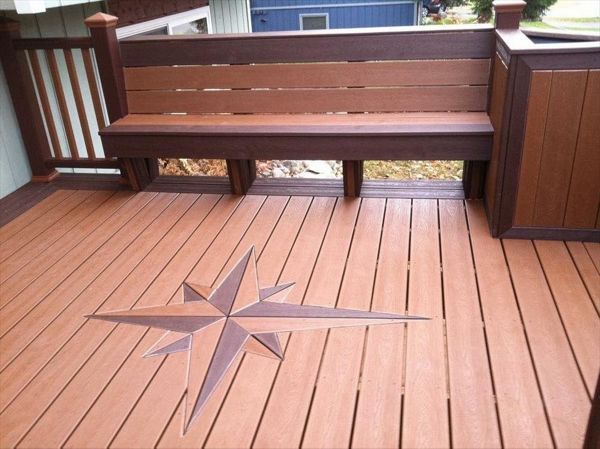 This deck features signature compass, bench seating, planters and 100% composite to include transcends railing!