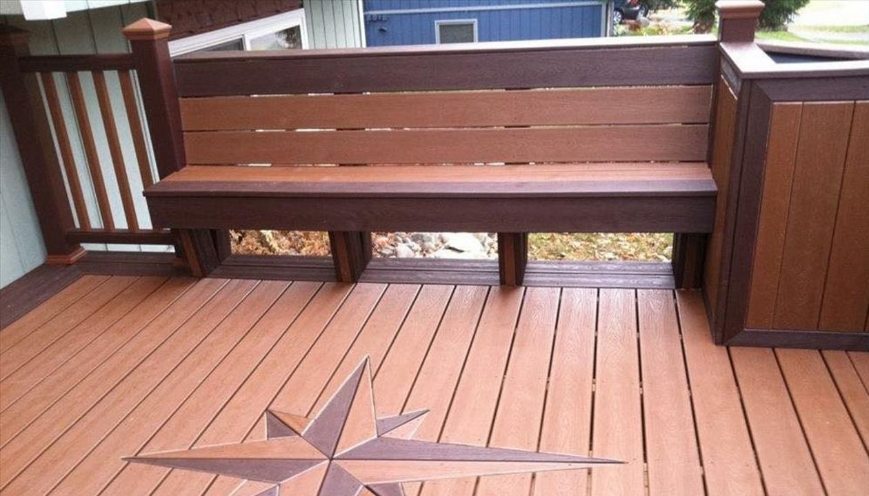 This deck features signature compass, bench seating, planters and 100% composite to include transcends railing!