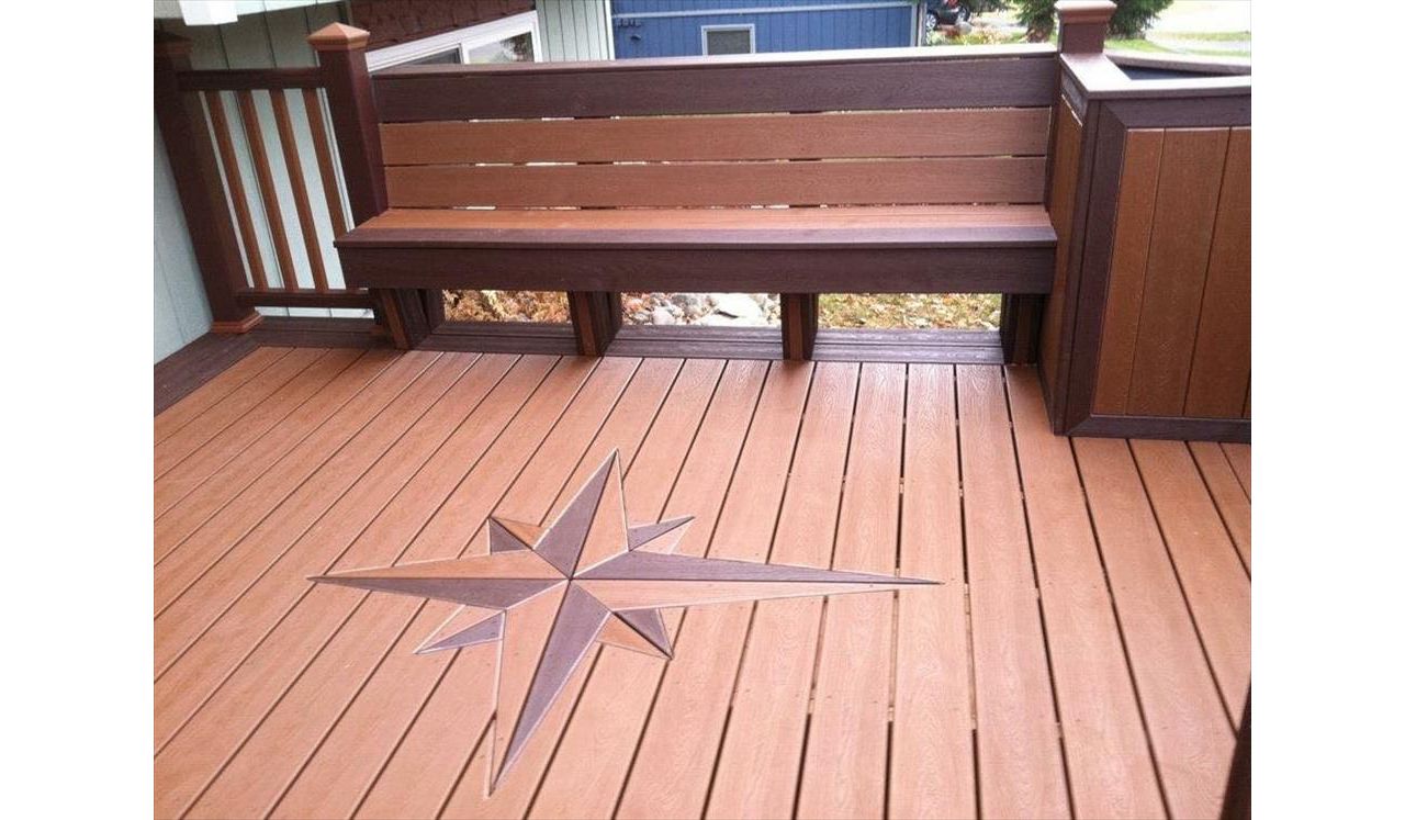 This deck features signature compass, bench seating, planters and 100% composite to include transcends railing!