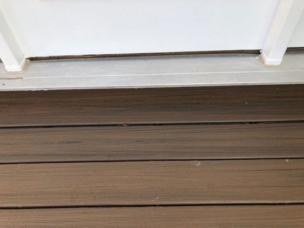 Another example of custom carpentry with the trim underneath the door threshold