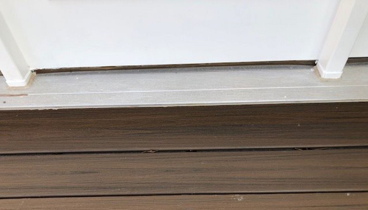 Another example of custom carpentry with the trim underneath the door threshold