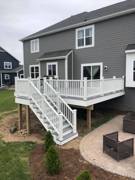 This deck features all white transcend railing and fascia. It has Trex select pebble grey decking.