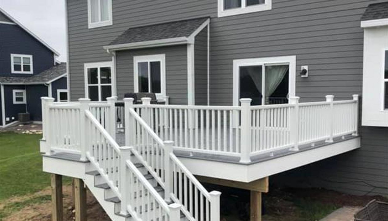 This deck features all white transcend railing and fascia. It has Trex select pebble grey decking.