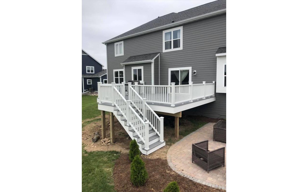 This deck features all white transcend railing and fascia. It has Trex select pebble grey decking.