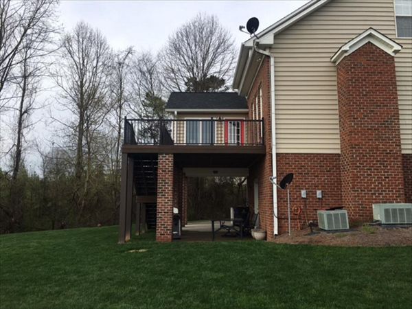 Trex Transcend deck works in perfect harmony with this brick and siding exterior