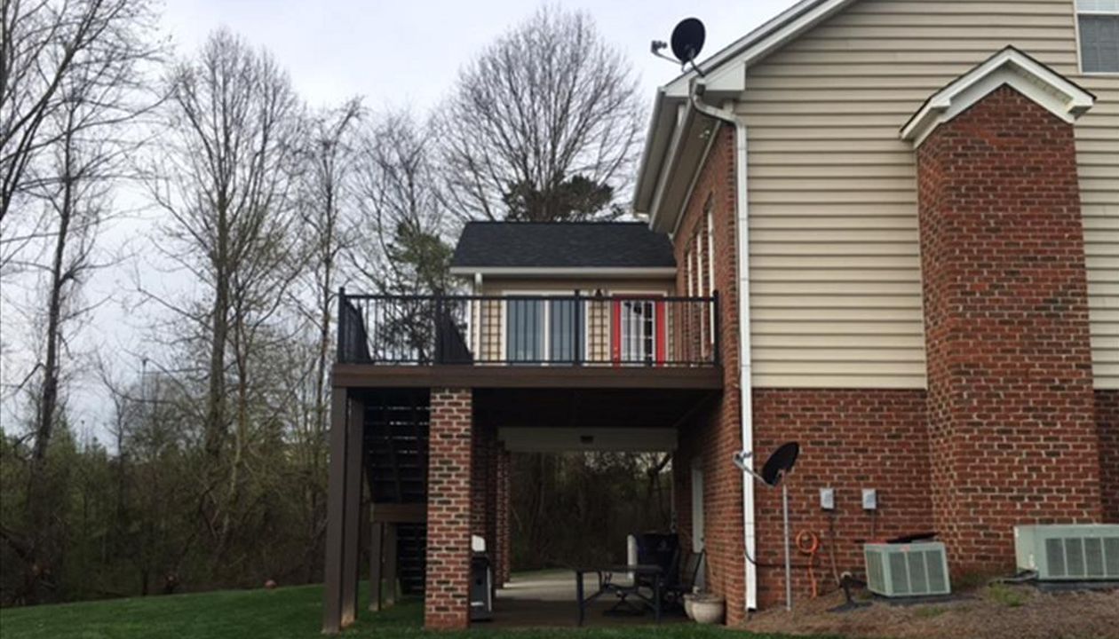 Trex Transcend deck works in perfect harmony with this brick and siding exterior