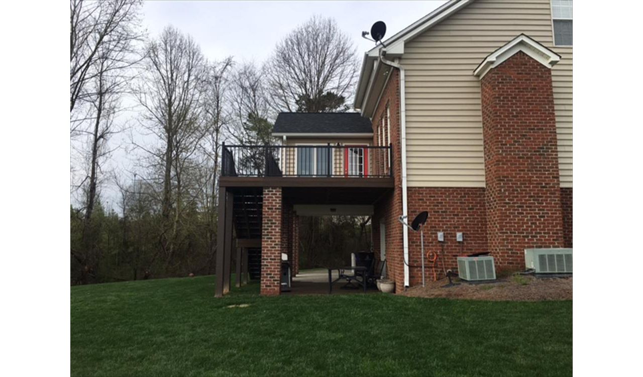 Trex Transcend deck works in perfect harmony with this brick and siding exterior