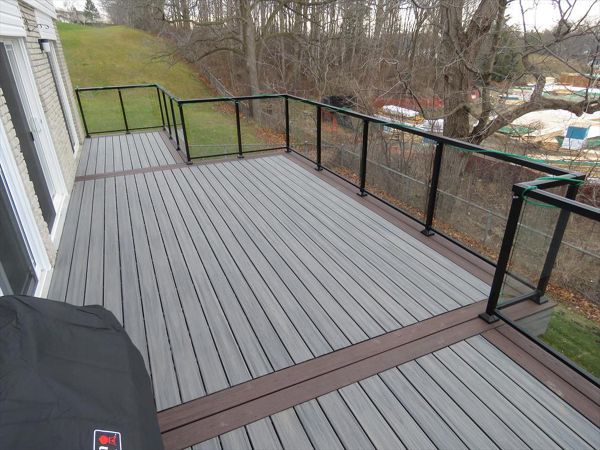 Island Mist for the main decking and Spiced Rum as the accent. The Glass railing provides a great view.