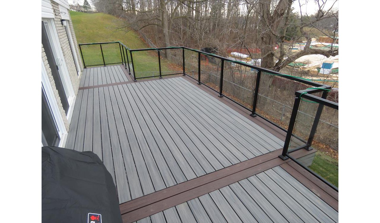 Island Mist for the main decking and Spiced Rum as the accent. The Glass railing provides a great view.
