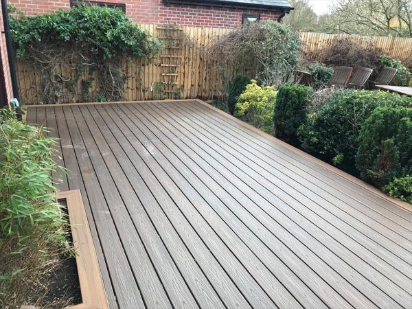 Existing wooden decking was removed and replaced with Spiced Rum with a Torino Brown picture frame. The decking can now be used all year round.