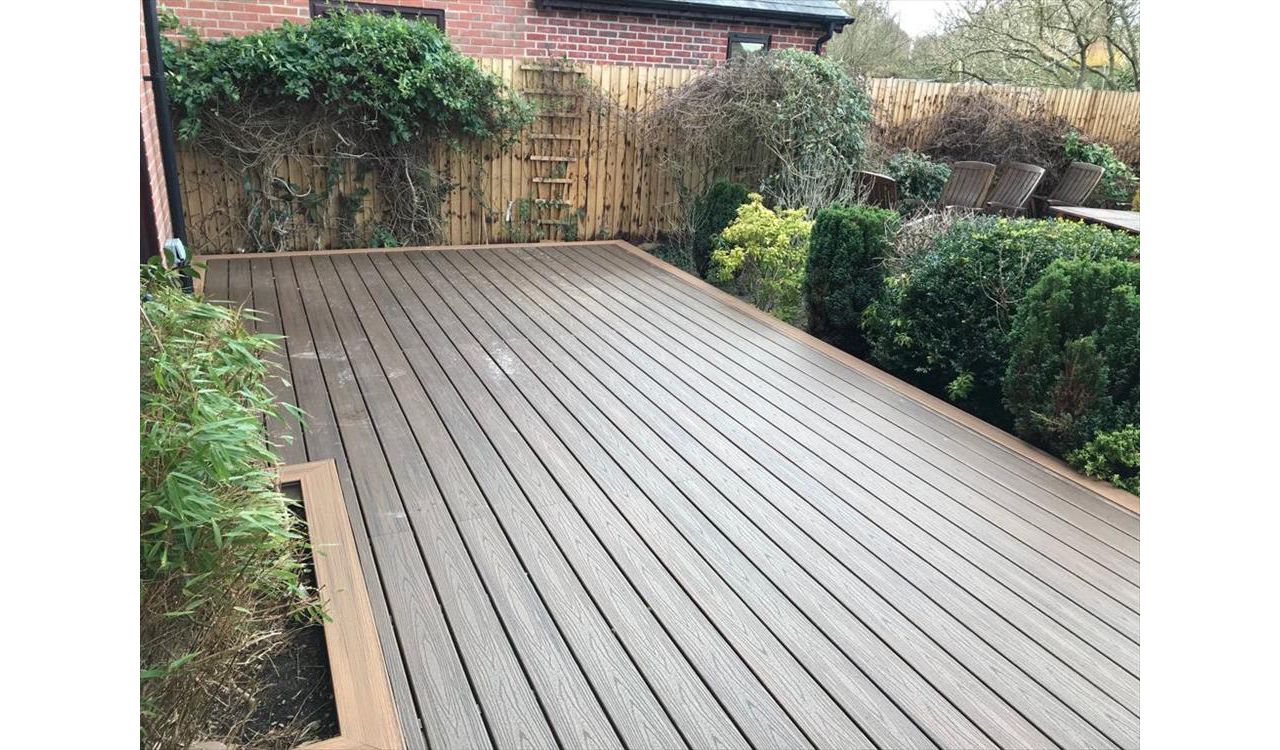 Existing wooden decking was removed and replaced with Spiced Rum with a Torino Brown picture frame. The decking can now be used all year round.