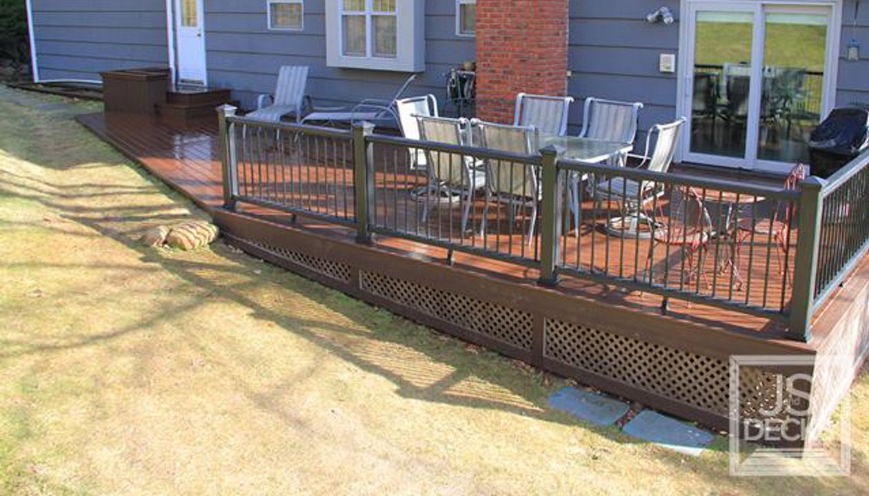 Lava Rock decking with Black Railing and chocolate lattice