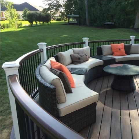 Stylish, curved deck featuring a comfortable outdoor lounging space.