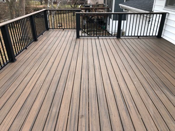 Trex/Transcend/Composite Decking and Trex/Transcend/Spiced Rum Fascia and Border with Trex/Signature/Rod-Rail (all black) and Trex/Transcend/Spiced Rum Composite Decking Cocktail Rail