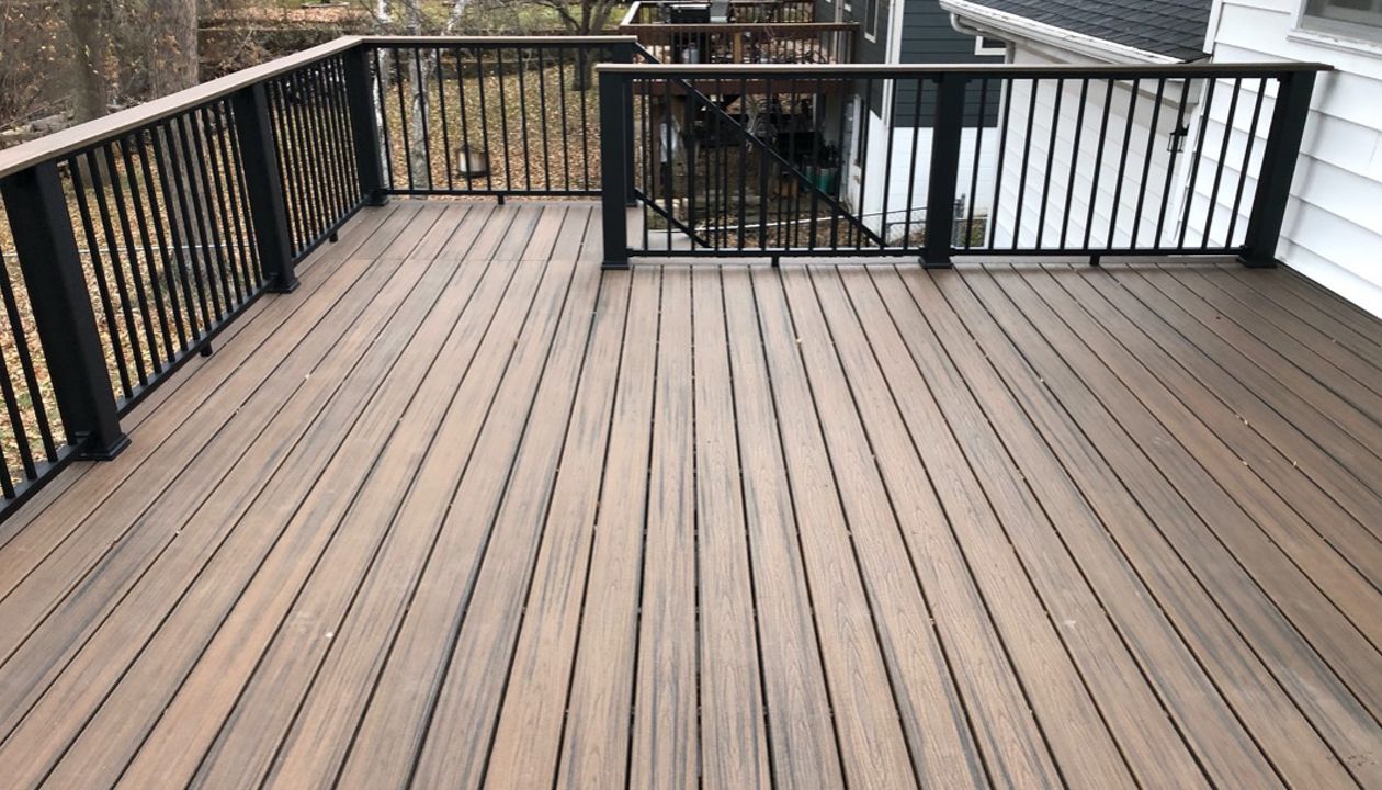 Trex/Transcend/Composite Decking and Trex/Transcend/Spiced Rum Fascia and Border with Trex/Signature/Rod-Rail (all black) and Trex/Transcend/Spiced Rum Composite Decking Cocktail Rail