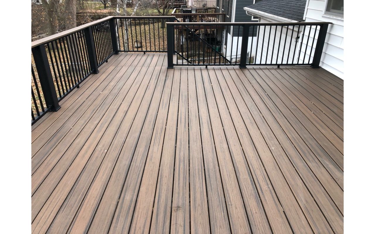 Trex/Transcend/Composite Decking and Trex/Transcend/Spiced Rum Fascia and Border with Trex/Signature/Rod-Rail (all black) and Trex/Transcend/Spiced Rum Composite Decking Cocktail Rail