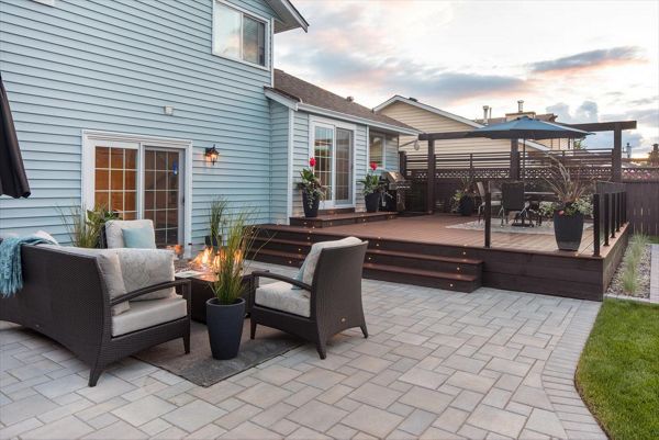 Trex Transcend Lava Rock with LED deck lighting, fire table and topless glass railings. Project location Pitt Meadows BC