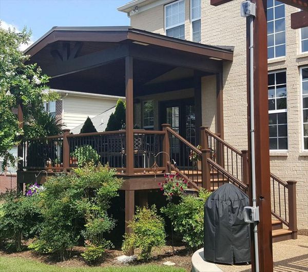 Trex deck with roof we built as part of an outdoor living space project at this home in Gallatin, TN