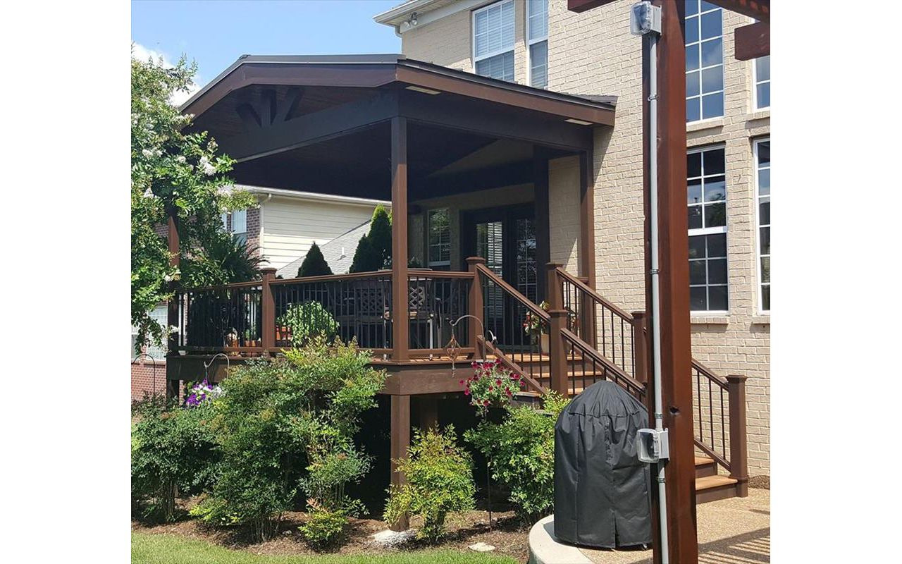Trex deck with roof we built as part of an outdoor living space project at this home in Gallatin, TN