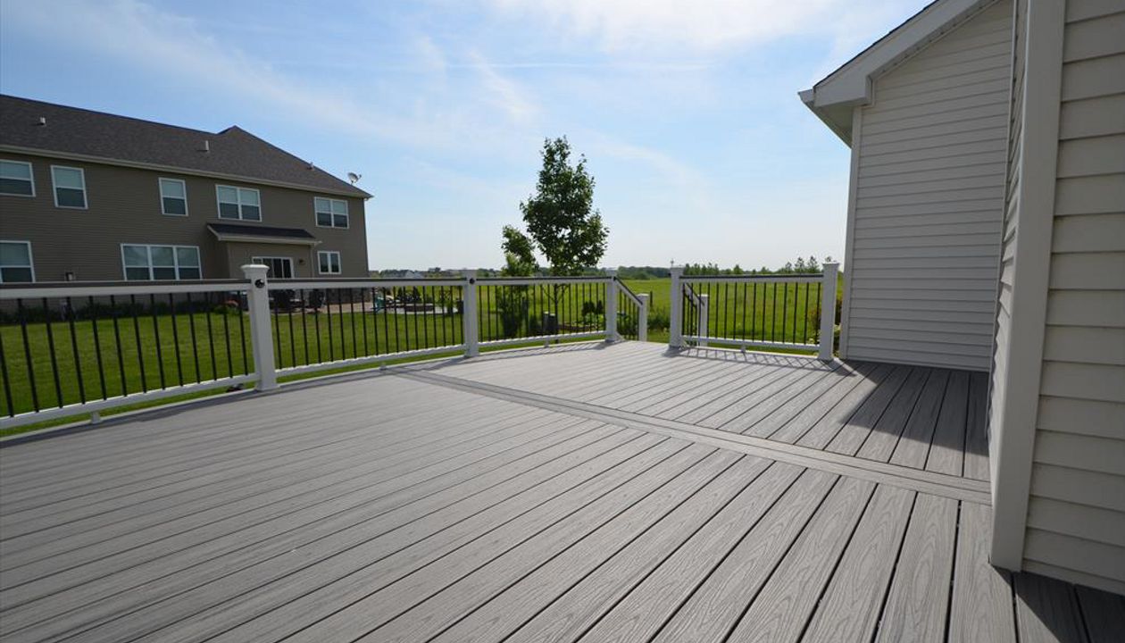 Trex Transcend Island Mist Decking with White Railings and Black Round Aluminum Balusters - Sugar Grove, IL