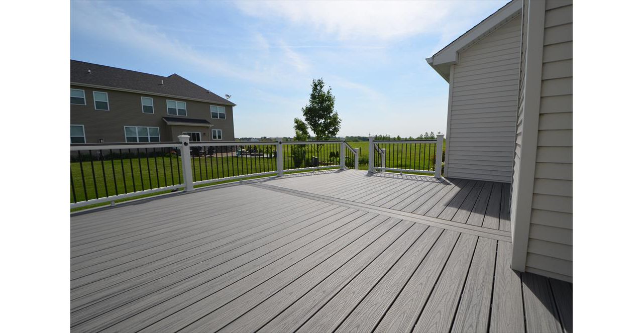 Trex Transcend Island Mist Decking with White Railings and Black Round Aluminum Balusters - Sugar Grove, IL