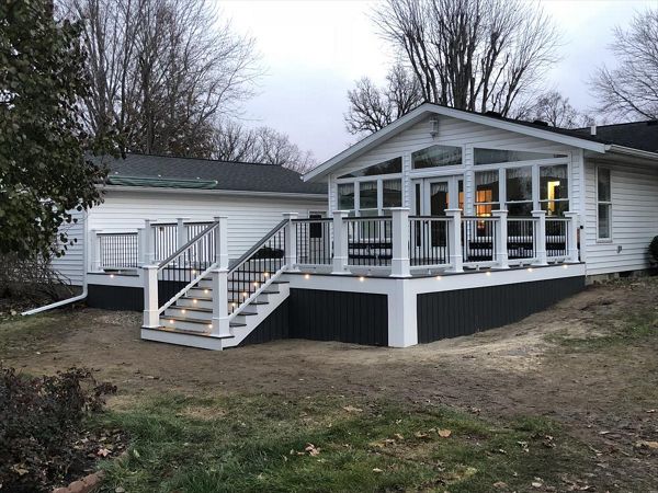 450sf deck with rim and stair lighting trimmed with Versatex and Trex clamshell decking.