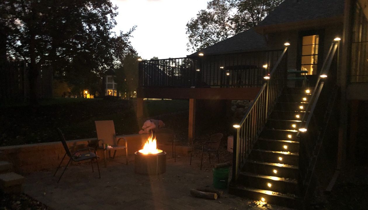 Trex Signature rail with Transcend decking offers unique lighting options. Post cap lights and riser lights make this deck/patio combo a great place to relax any time of day!