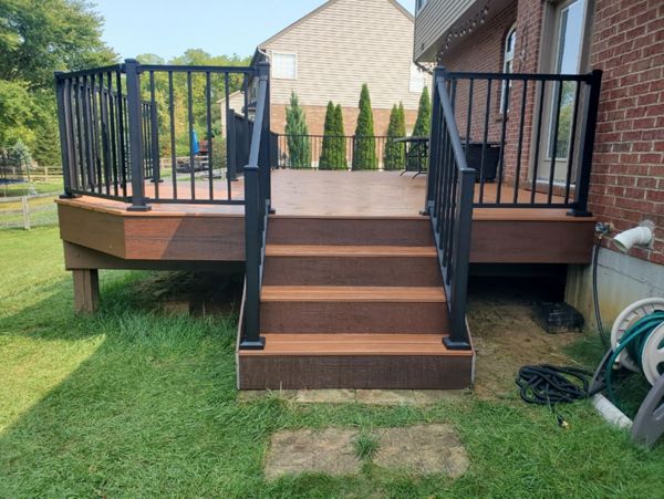 Trex Transcend Tiki Torch deck w/ Lava Rock fascia. Trex Signature aluminum railing