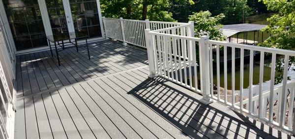 Pebble Grey Decking with White Aluminum Railing done in Sunrise Beach, MO at Lake of the Ozarks